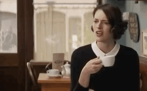 Woman Drinking Coffee Making Funny Face