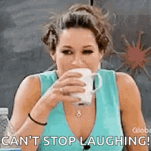 Woman Drinking From Cup and Laughing