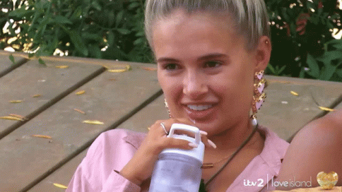 Woman Drinking From Itv 2 Love Island Bottle