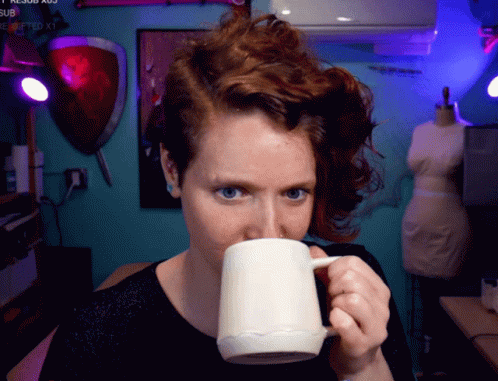 Woman Drinking from Mug with Submitted Watermark