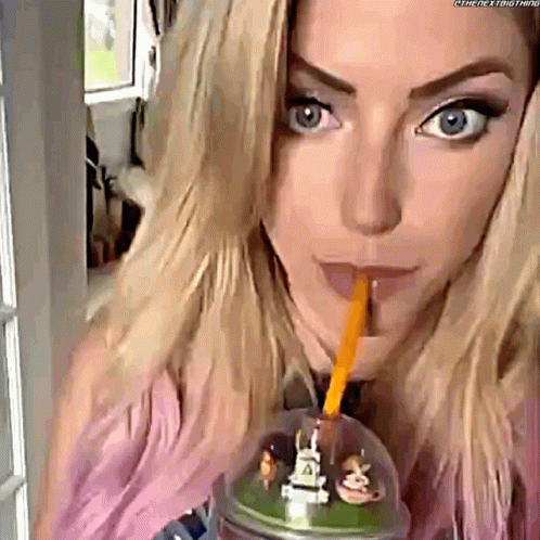 Woman Drinking from Plastic Cup with Straw