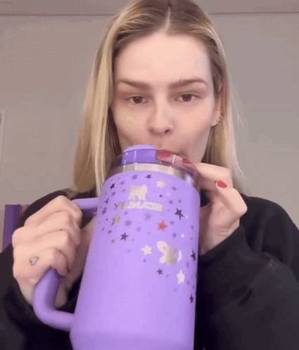 Woman Drinking from Purple Unicorn Tumbler
