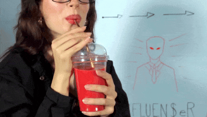 Woman Drinking From Red Cup With Fluencer