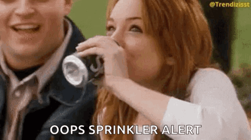 Woman Drinking Soda and Laughing Man Looking On