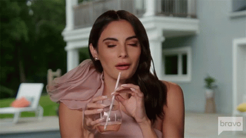 Woman Drinking Through Straw From Bravo Glass
