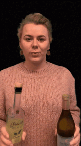 Woman Drinking Two Alcohol Bottles GIF