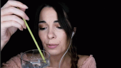 Woman Drinking Water With Straw And Headphones GIF
