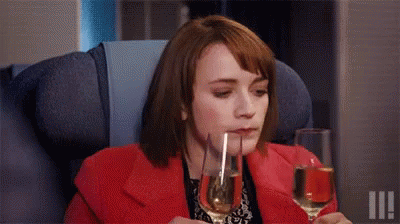 Woman Drinks 2 Glasses Of Prosecco GIF