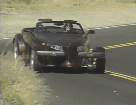Woman Driving Black Convertible