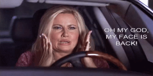 Woman Driving Car Hands on Face Oh My God My Face Is Back