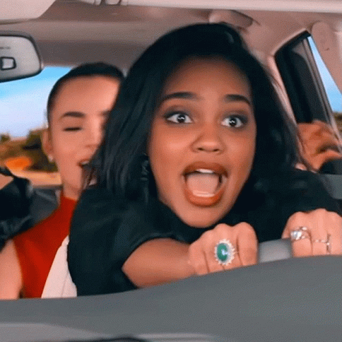 Woman Driving Car With Mouth Open