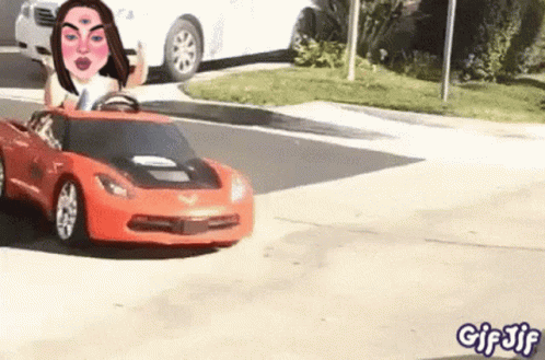 Woman Driving Toy Car Down Street GIF