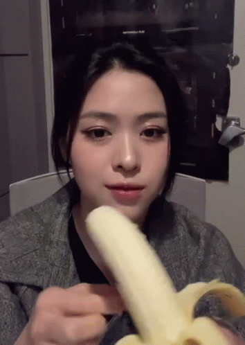 Woman Eating Banana By Avengers Poster GIF
