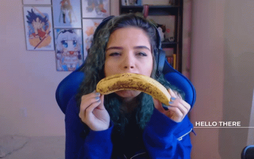 Woman Eating Banana Saying Hello There