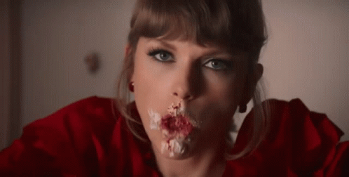 Woman Eating Cake With Icing On Mouth GIF