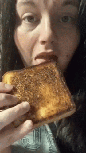 Woman Eating Grilled Cheese Sandwich