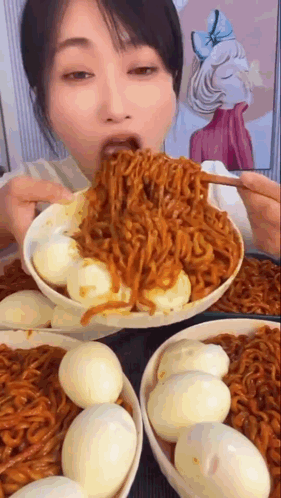 Woman Eating Noodles and Eggs From Bowl