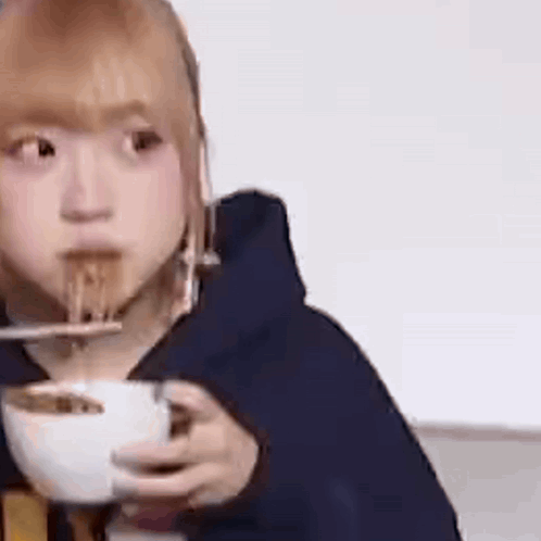 Woman Eating Noodles With Chopsticks