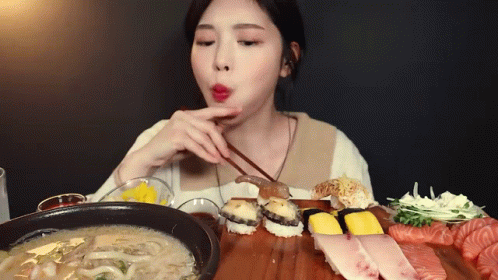 Woman Eating Sushi With Chopsticks And Soup GIF