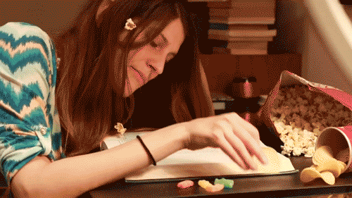 Woman Eating While Reading Bar Exam GIF