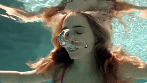 Woman Enjoying A Swim In The Pool GIF