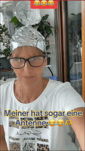 Woman Explaining Her Tin Hat GIF