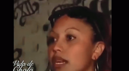 Woman Face Close Up In Front Of Wall GIF