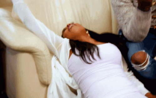 Woman Fall Out On Sofa GIF