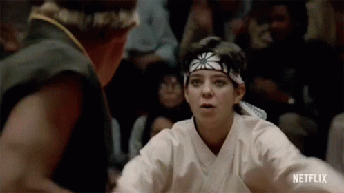 Woman Fighting Man In Karate Ring GIF
