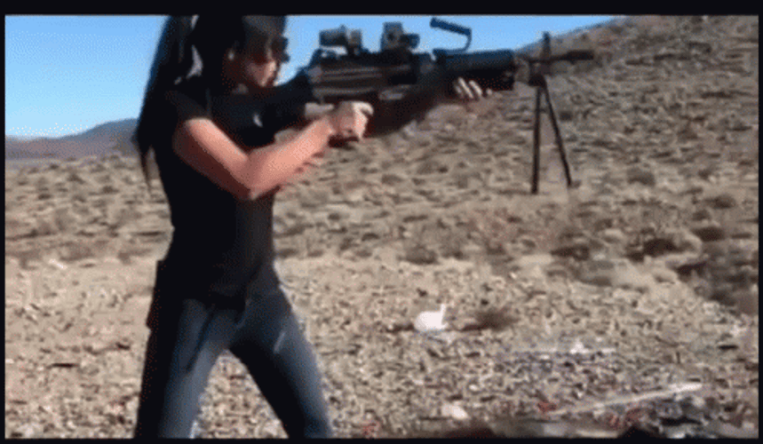 Woman Firing A Machine Gun GIF