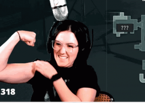 Woman Flexing Muscles in Front of Microphone With Number 318
