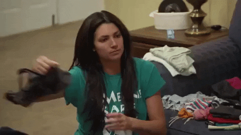 Woman Folding Clothes With Side Eye Meme GIF