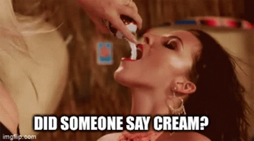 Woman Getting Cream From Woman's Mouth