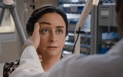 Woman Getting Eye Exam From Doctor GIF