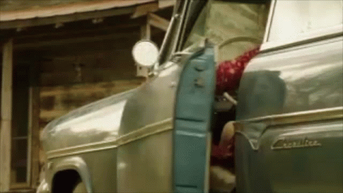 Woman Getting Out of Old Truck Legs Out Door