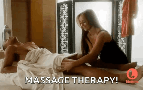 Woman Giving Man Massage With Massage Therapy