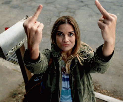 Woman Giving Middle Finger in Front of Mailbox