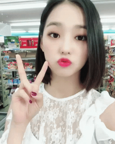 Woman Giving Peace Sign GIF