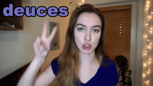 Woman Giving Peace Sign Saying Deuces