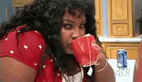 Woman Glare While Sipping Coffee GIF