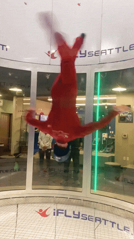 Woman Head Down Indoor Skydiving GIF