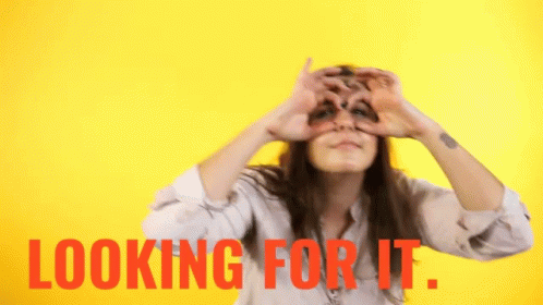 Woman Heart Gesture Looking For It Behind Her GIF