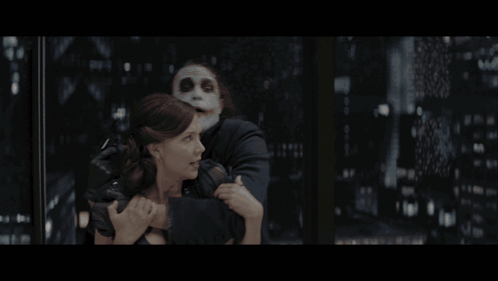Woman Held By Masked Man Saying Oh Sure GIF