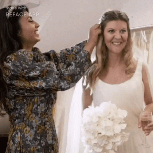 Woman Helping Bride With Wedding Dress GIF