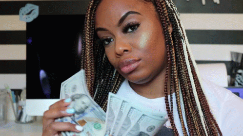 Woman Holding 100 Dollar Bills