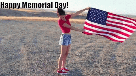 Woman Holding American Flag in Dirt Saying Happy Memorial Day