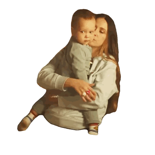 Woman Holding Baby in Lap