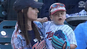 Woman Holding Baby In Twins Jersey GIF