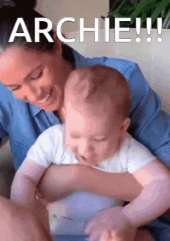 Woman Holding Baby Saying Archie GIF