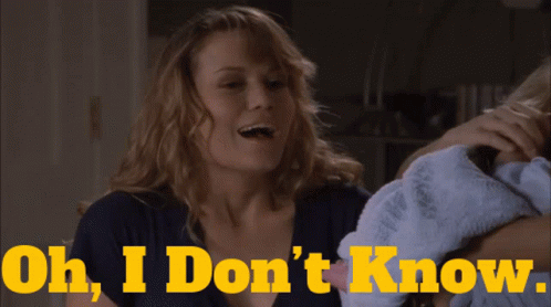 Woman Holding Baby Saying Oh I Don't Know GIF